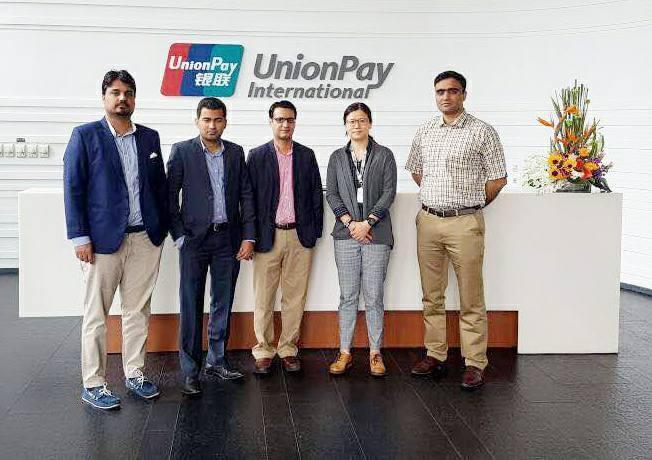 Ahmed Ali Larik with colleagues at UnionPay International headquarters